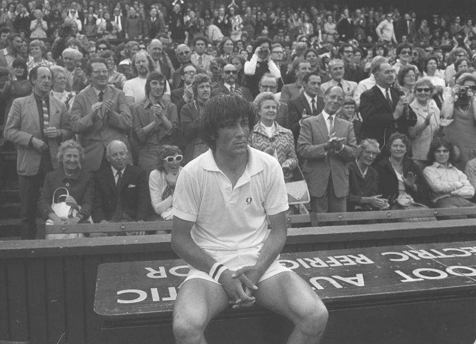 <p>Roumanian Ilie Nastase takes a seat after losing the Wimbledon Men's Singles Final to Stan Smith in 1972.</p>