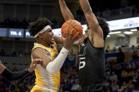 Pittsburgh forward Blake Hinson (2) reaches to shoot against Miami forward Norchad Omier (15) during the first half of an NCAA college basketball game in Pittsburgh, Saturday, Jan. 28, 2023. (AP Photo/Matt Freed)