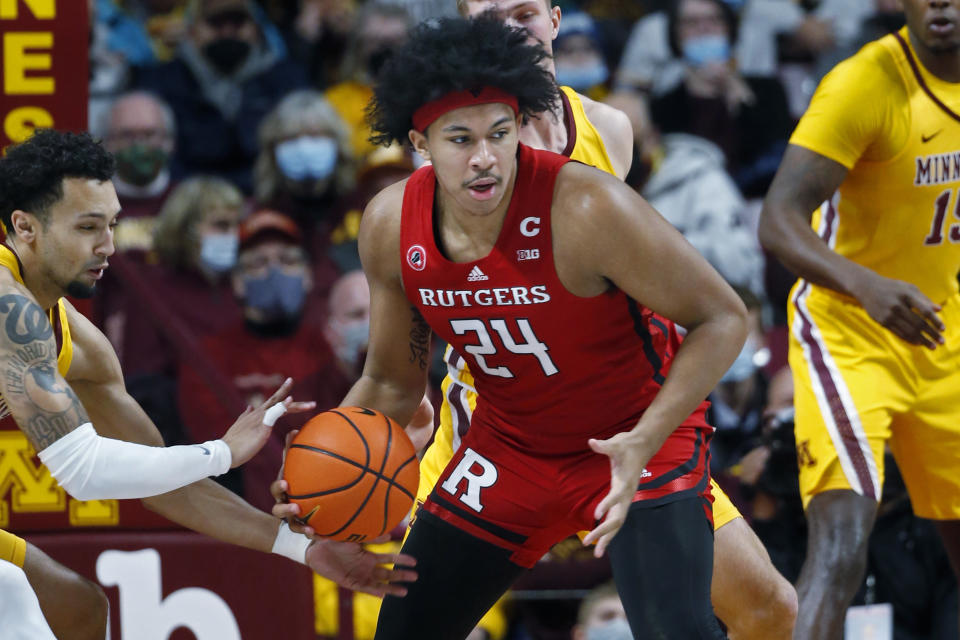 Minnesota guard Payton Willis steals the ball away from Rutgers guard Ron Harper Jr. (24) in the first half of an NCAA college basketball game Saturday, Jan. 22, 2022, in Minneapolis. (AP Photo/Bruce Kluckhohn)