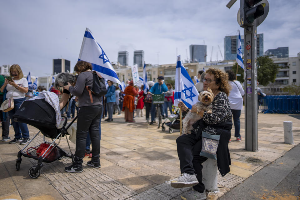 Israeli "grandmothers for democracy" protest plans by Prime Minister Benjamin Netanyahu's government to overhaul the judicial system, saying the planned reform is worrying for the future of the country, in Tel Aviv, Israel, Wednesday, March 22, 2023. (AP Photo/Oded Balilty)
