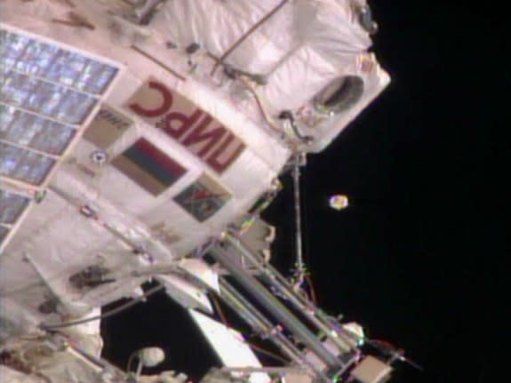 An unidentified object floats near the International Space Station on August 19, 2013. Russian ground controllers later identified it as an antenna cover from the Zvezda service module.