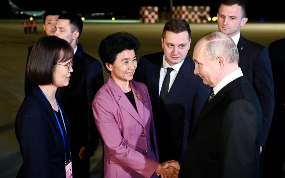 Russian President Vladimir Putin is welcomed by officials upon his arrival at the airport of Harbin, China, May 16, 2024.