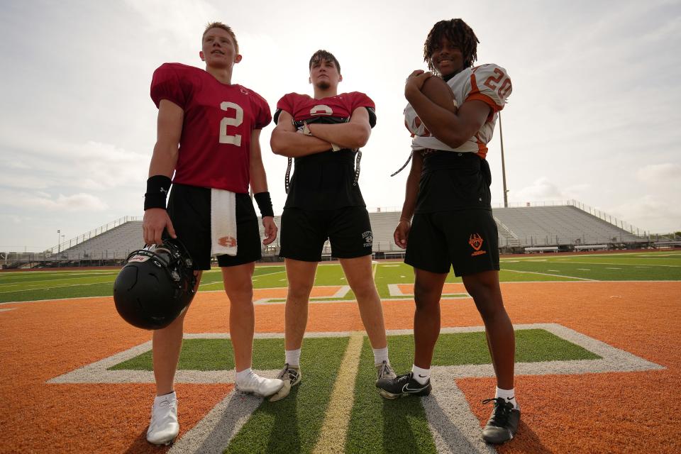 From left, Hutto quarterback Will Hammond, linebacker and defensive end Brody Bujnoch and running back Jalon Banks will be the leaders of the Hippos' squad this year. Former Johnson offensive coordinator Will Compton takes over Brad LaPlante's program this season.