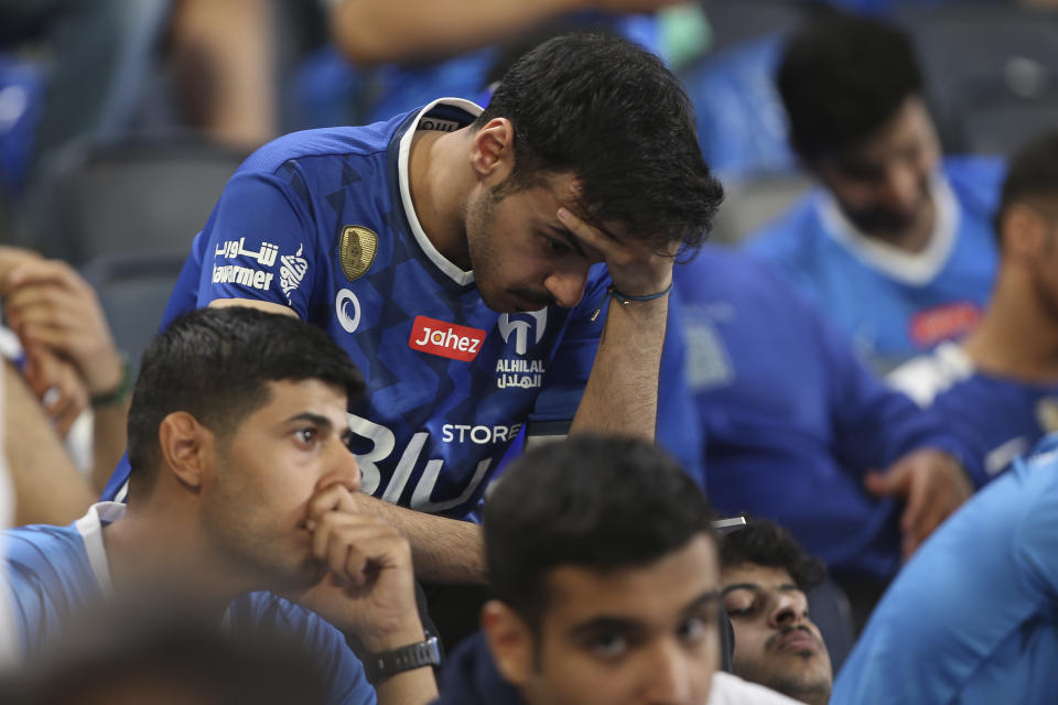 Saudi Arabia's Al Hilal fans react during a second leg of the AFC Champions League 2023/24 semi-final match against UAE's Al Ain at Kingdom Arena Stadium in Riyadh, Saudi Arabia,Tuesday, April 23, 2024. (AP Photo)