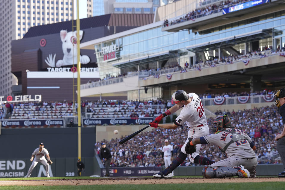 Minnesota Twins' Max Kepler connects for a double in the first inning of Game 3 of an American League Division Series baseball game against the Houston Astros, Tuesday, Oct. 10, 2023, in Minneapolis. (AP Photo/Jordan Johnson)