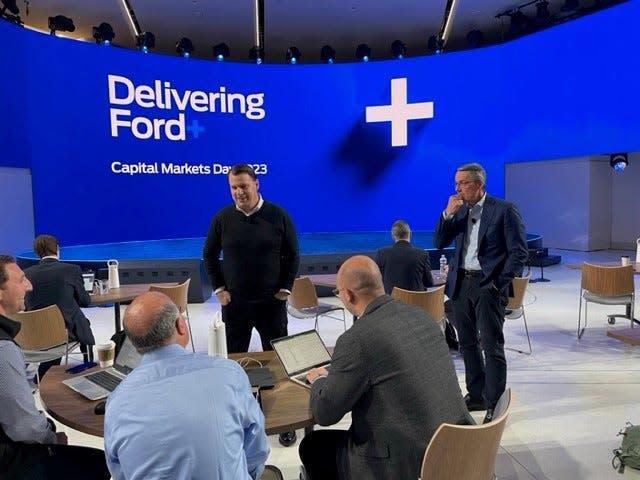 Ford CEO Jim Farley, with Ford Chief Financial Officer John Lawler to his right, talks with investor analysts prior to the start of his Capital Markets Day speech at the Ford Experience Center in Dearborn on May 22, 2023.