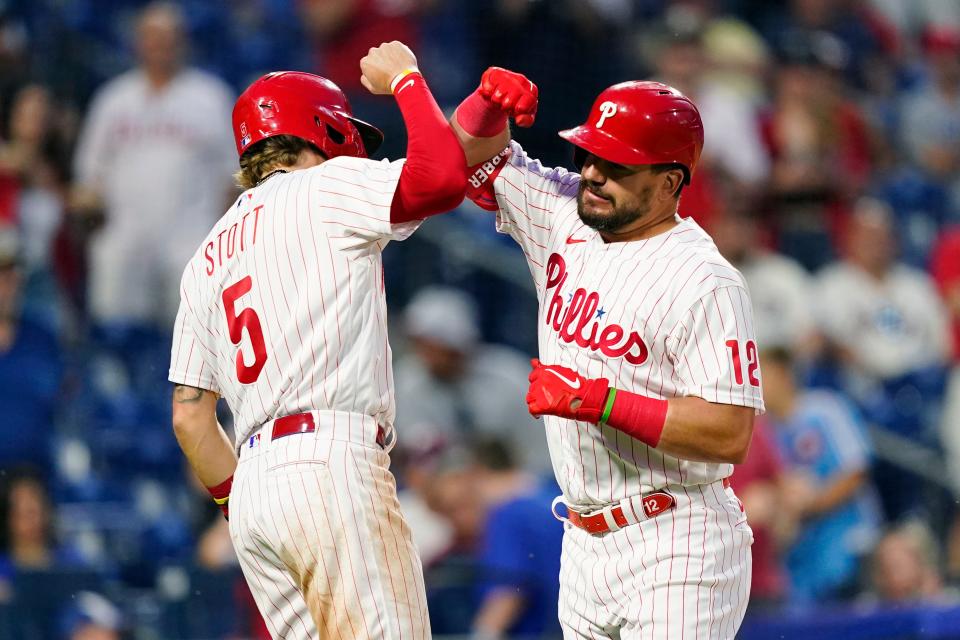 Philadelphia Phillies' Kyle Schwarber, right, and Bryson Stott celebrate after Schwarber's two-run home run against San Francisco Giants pitcher Jarlin Garcia during the sixth inning of a baseball game, Wednesday, June 1, 2022, in Philadelphia. (AP Photo/Matt Slocum)