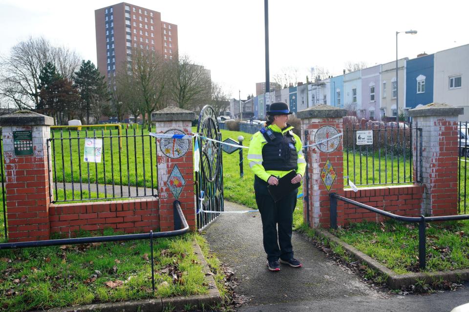 Police at Rawnsley Park near to the scene in the St Philips area of Bristol where a 16-year-old boy has died after being stabbed on Wednesday evening (PA)