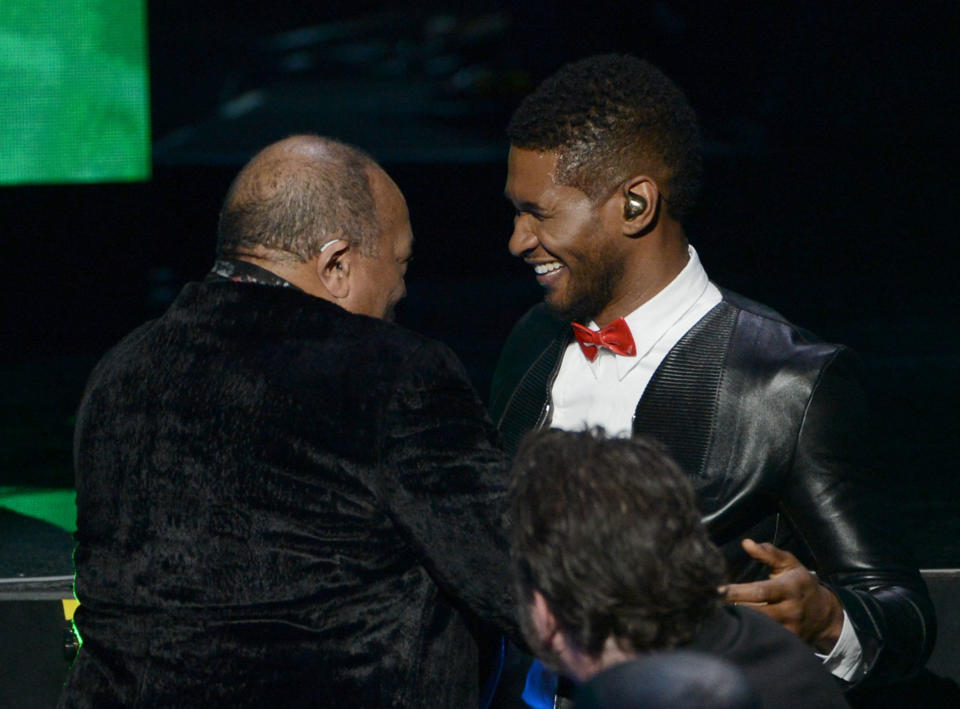 LOS ANGELES, CA - APRIL 18:  Singer Usher presents inductee Quincy Jones (L) the Ahmet Ertegun Award for Lifetime Achievement on stage at the 28th Annual Rock and Roll Hall of Fame Induction Ceremony at Nokia Theatre L.A. Live on April 18, 2013 in Los Angeles, California.  (Photo by Kevin Winter/Getty Images)