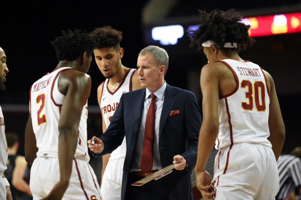 Andy Enfield talks to his players during USC’s 88-81 loss to Washington. (Getty)