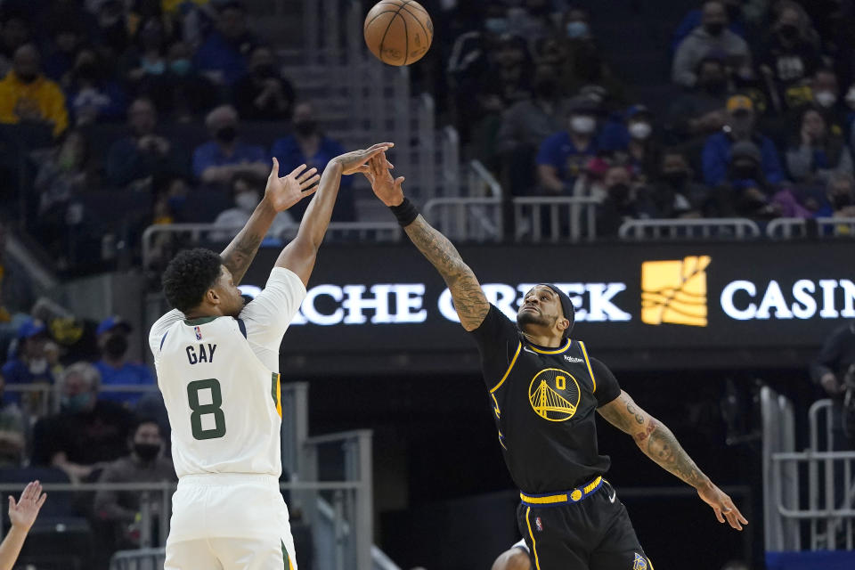 Utah Jazz forward Rudy Gay (8) shoots a 3-point basket over Golden State Warriors guard Gary Payton II (0) during the first half of an NBA basketball game in San Francisco, Sunday, Jan. 23, 2022. (AP Photo/Jeff Chiu)