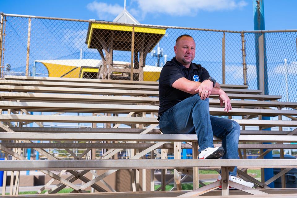 Sports agent and Palm Beach County resident Phil Terrano poses for a portrait sitting on bleachers at the East Boynton Little League Complex on Tuesday, February 7, 2023, in Boynton Beach, FL. Terrano, who grew up playing little league baseball at the complex, wants to build a baseball training complex adjacent to the Little League fields that would benefit athletes of all levels.