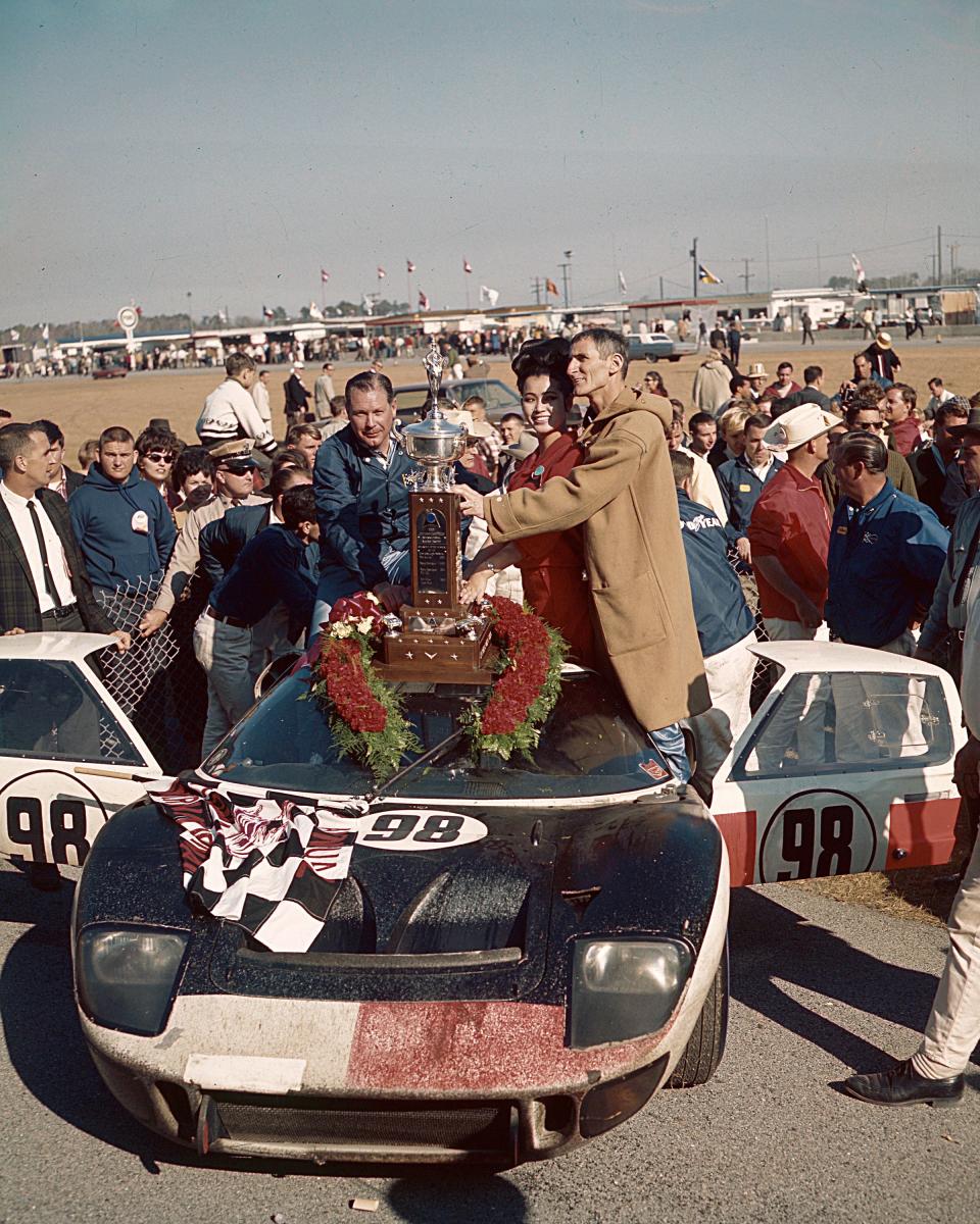 Lloyd Ruby and Ken Miles celebrate their second straight Daytona win in 1966.