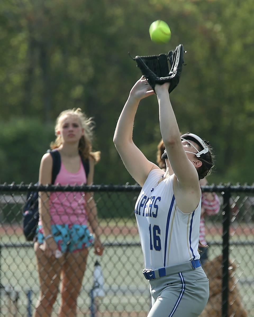 Norwell’s Penny Saich gets underneath the ball to catch the fly ball in the top of the first inning during their game against Scituate at the Norwell Clipper Community Complex on Friday, May 12, 2023. 