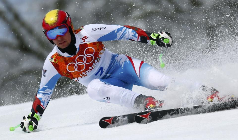 Austria's Marcel Hirscher skis during the first run of the men's alpine skiing giant slalom event at the 2014 Sochi Winter Olympics at the Rosa Khutor Alpine Center February 19, 2014. REUTERS/Dominic Ebenbichler (RUSSIA - Tags: SPORT SKIING OLYMPICS)