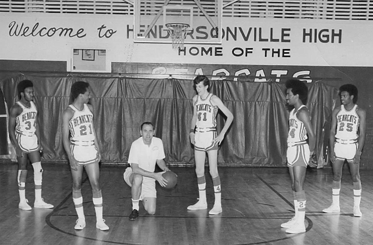 Coach Jim Pardue poses with the starting five from Hendersonville's 1971-72 state championship team. Team members from left to right are Johnny Landrum, Dennis Braswell, Brian Tallent, Tippy Creswell and Harold Albany.