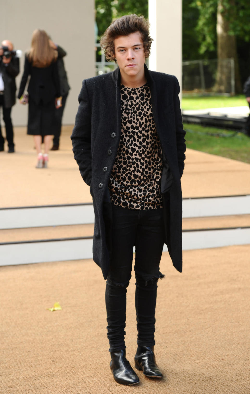 <p>Yes, Harry Styles can even pull off a leopard print T-shirt. <i>[Photo: Rex]</i></p>