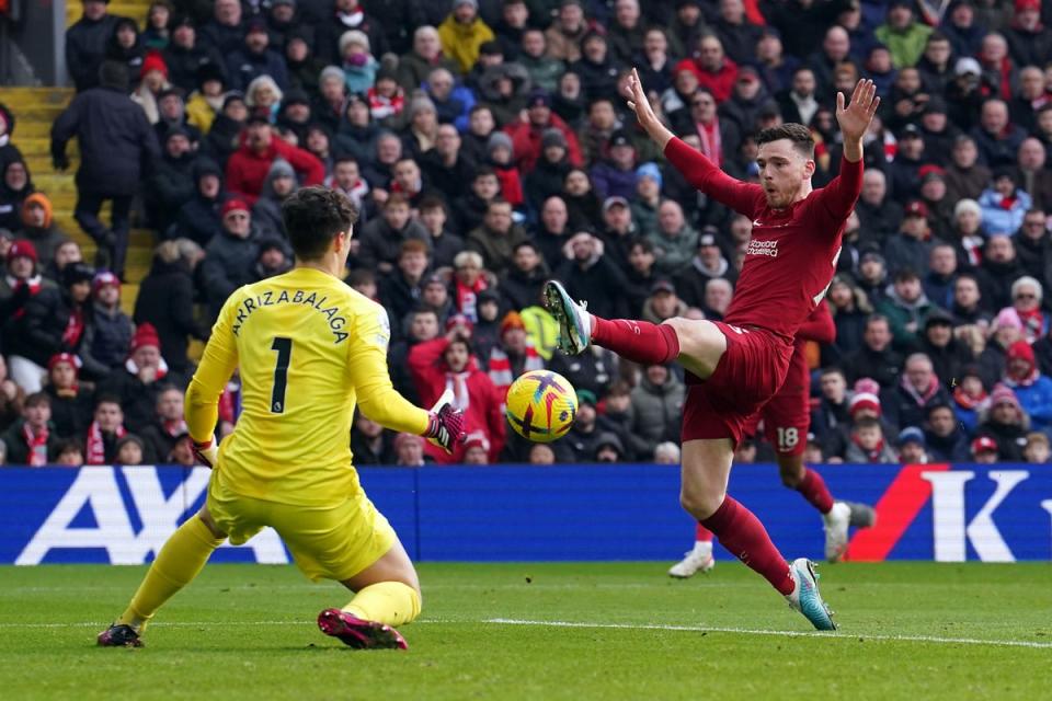 Chelsea goalkeeper Kepa Arrizabalaga saves at the feet of Liverpool’s Andrew Robertson (Martin Rickett/PA) (PA Wire)