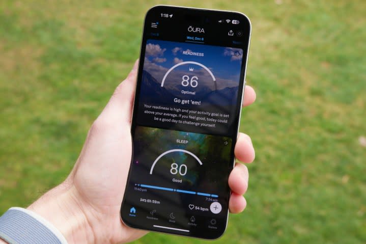 Someone holding an iPhone with the Oura app running on it.