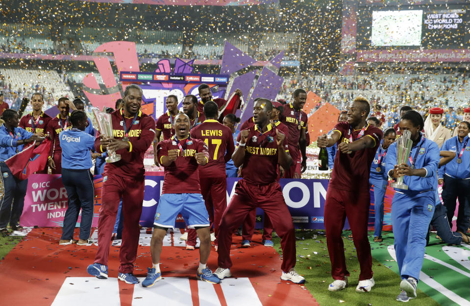 FILE - The West Indies men's and women's team celebrate after winning their finals matches of the ICC World Twenty20 2016 cricket tournament at Eden Gardens in Kolkata, India, Sunday, April 3, 2016. The ninth T20 World Cup starts on June 1. The Caribbean and the United States are sharing co-host duties. (AP Photo/Saurabh Das, File)