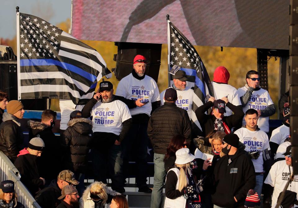 Supporters of law enforcement gather as they wait for President Donald Trump to speak to supporters at the Waukesha County Airport on Saturday.