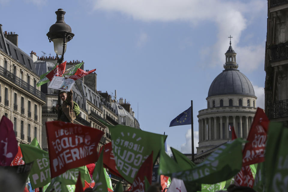 Conservative activists gather to protest in Paris, Sunday Oct. 6, 2019, against a French bill that would give lesbian couples and single women access to in vitro fertilization and related procedures. Traditional Catholic groups and far-right activists organized Sunday's protest, arguing that it deprives children of the right to a father. (AP Photo/Rafael Yaghobzadeh)