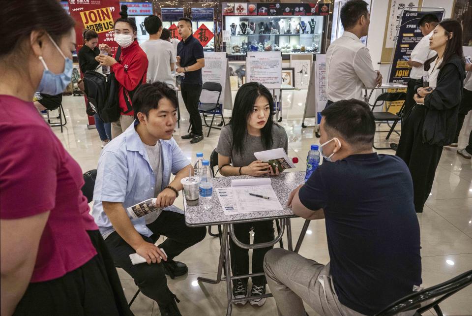 Workers In China Seek Employment At Job Fair (Kevin Frayer / Getty Images)
