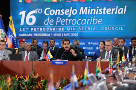 Venezuela's President Nicolas Maduro (C) speaks during the 16th PetroCaribe Ministerial Council in Caracas May 27, 2016. Miraflores Palace/Handout via REUTERS