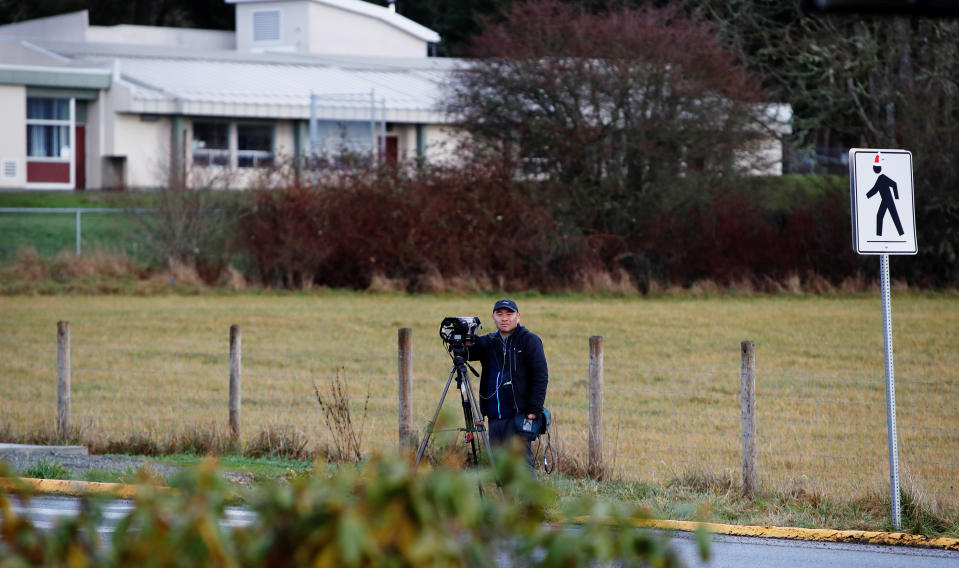 A member of the news media waits outside the Deep Cove market near the property where according to British news reports Prince Harry and Meghan, Duchess of Sussex are staying in North Saanich, British Columbia, Canada January 21, 2020. REUTERS/Kevin Light