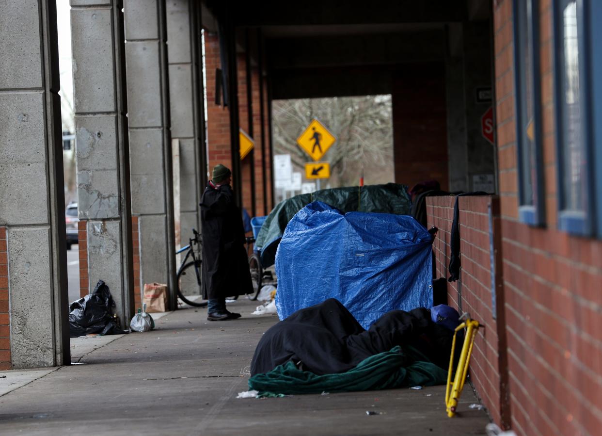 People camp alongside the Marion Parkade in Salem in January 2023. Momentum is building in a major case regarding homeless encampments that is before the U.S. Supreme Court. Dozens of briefs have been filed in recent days, including from the Department of Justice, members of Congress, and state attorneys general.