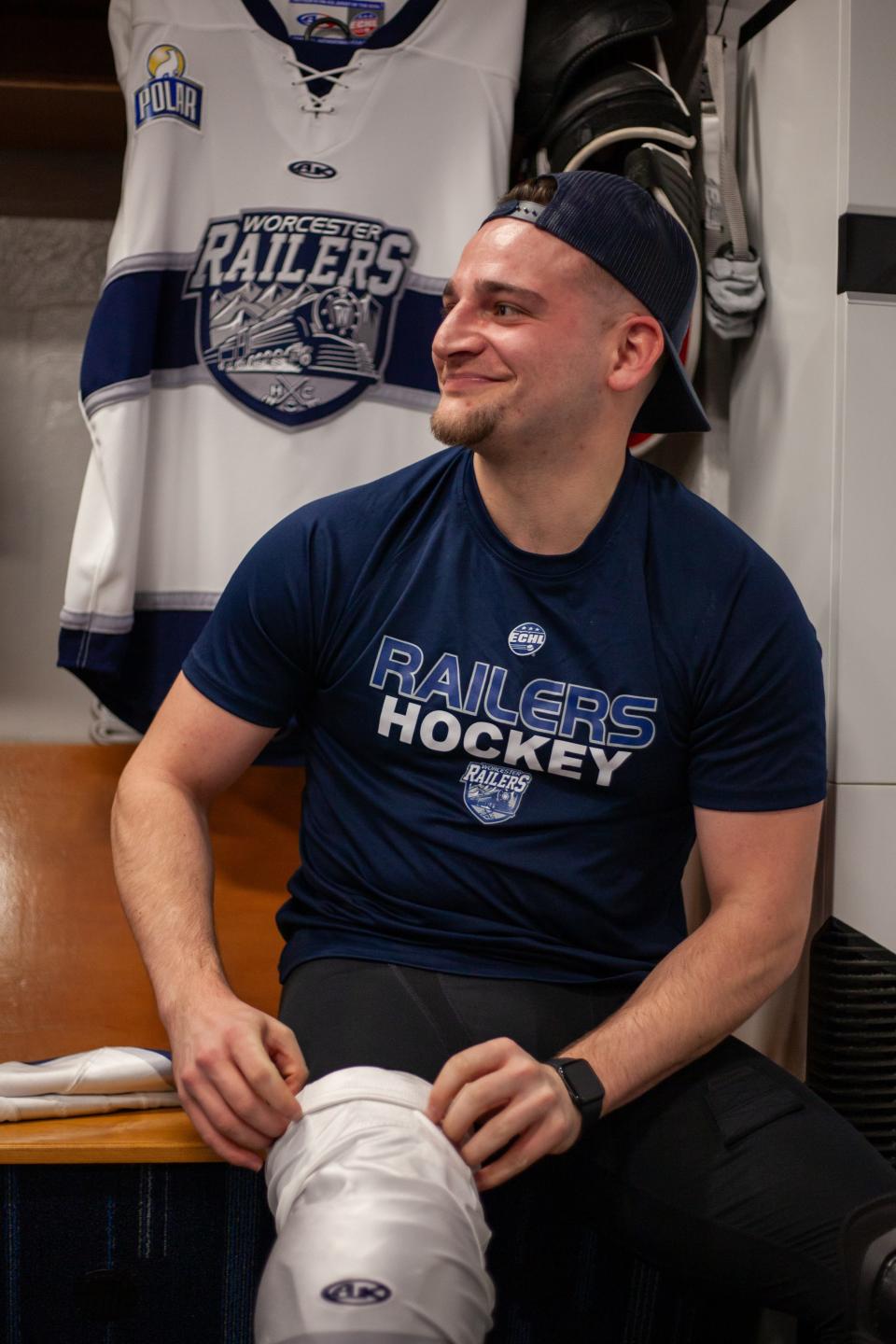 Worcester native Nick Pennucci enjoys a smile in the Railers locker room upon making his pro hockey debut last week.