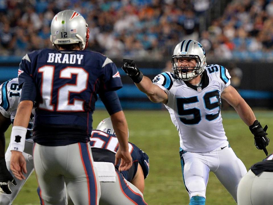 Carolina Panthers linebacker Luke Kuechly, right, points and yells out instructions to the defensive line as New England Patriots quarterback Tom Brady prepares to call a play in 2015. Brady played for the Patriots for 20 years, winning six Super Bowl titles.