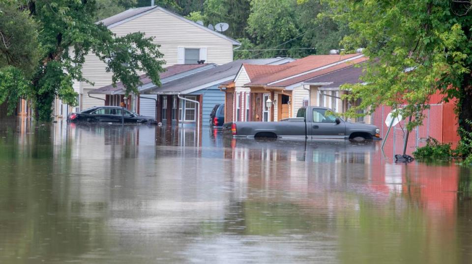 Homes and vehicles in the 600 block of Terrace Dr. in East St. Louis were flooded as water rose quickly in the area near the Harding ditch. Derik Holtmann