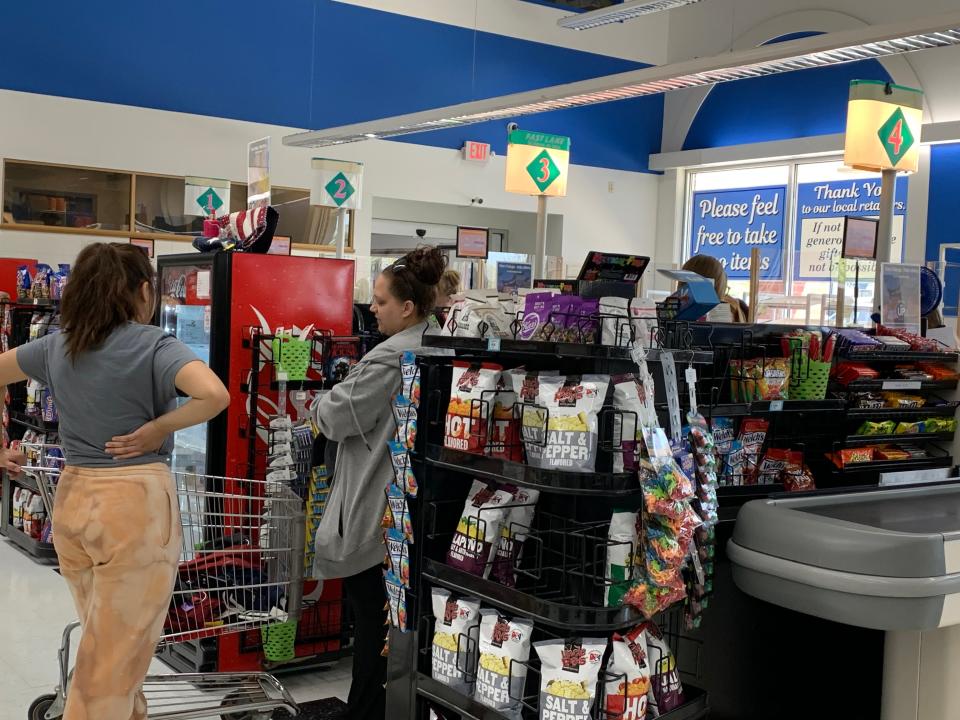 St. Vincent de Paul Waukesha thrift store customers check out on the first day since the organization reopened its local store during the 2020 COVID-19 pandemic.