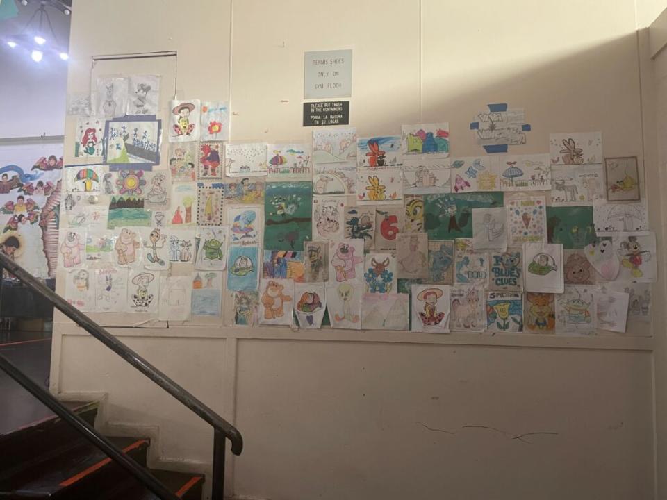  Artwork from migrant children who have temporarily stayed at the Sacred Heart Church shelter before heading to another destination in the U.S. (Photo by Ariana Figueroa/States Newsroom)