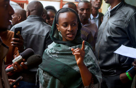 Anne Rwigara, representative of business at the Premier Tobacco Company, addresses the media during an auction of assets belonging to the family of Diane Shima Rwigara, a prominent critic of Rwanda's president Paul Kagame, in Kigali, Rwanda March 28, 2018. REUTERS/Jean Bizimana