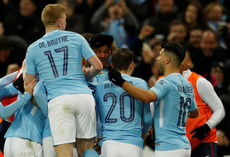 Soccer Football - Carabao Cup Final - Arsenal vs Manchester City - Wembley Stadium, London, Britain - February 25, 2018 Manchester City's Vincent Kompany celebrates scoring their second goal with teammates REUTERS/Peter Nicholls