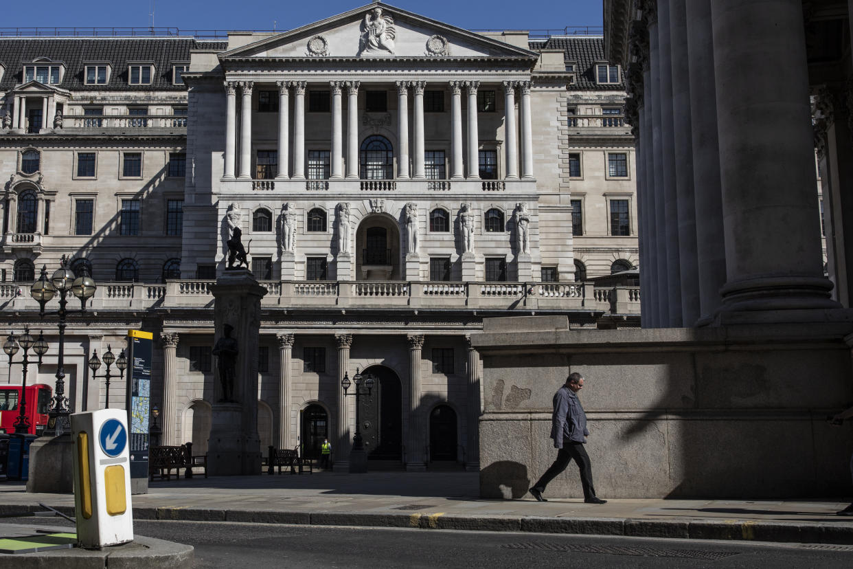 LONDON, ENGLAND - JUNE 01: A man walks past the Bank of England on June 01, 2020 in London, England. The British government further relaxed Covid-19 quarantine measures in England this week, allowing groups of six people from different households to meet in parks and gardens, subject to social distancing rules. Many schools also reopened and vulnerable people who are shielding in their homes are allowed to go outside again. (Photo by Dan Kitwood/Getty Images)