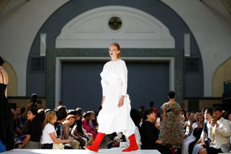 Models present creations during the Molly Goddard catwalk show during London Fashion Week in London