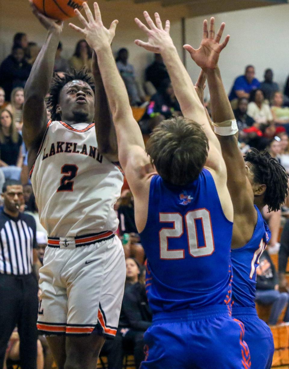 Lakeland's Derajah Hardy (2) goes up for a shot against Bartow on Friday night in the boys basketball Class 6A, District championship game.