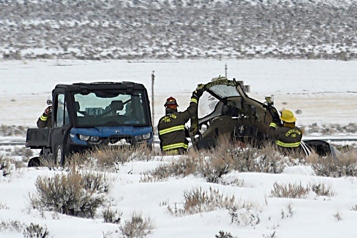 Authorities investigate the site of a Care Flight plane that crashed near Stagecoach on Feb. 25, 2023. Five people were killed in the crash.