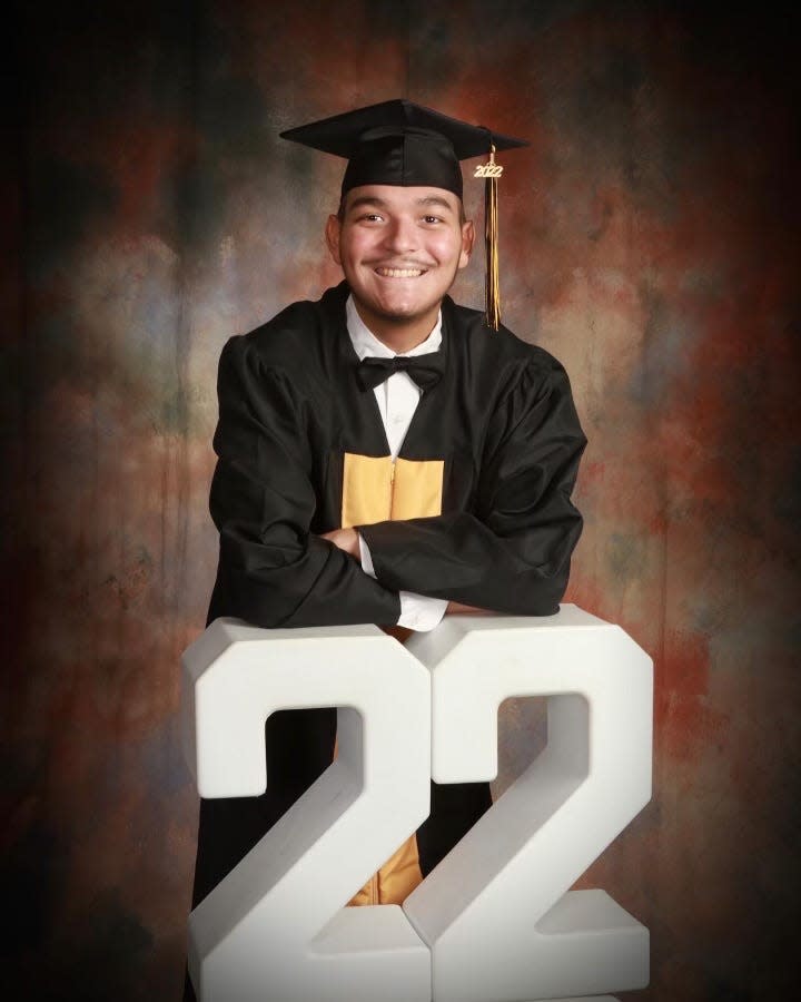 Adan Munoz poses for this graduation photo in his cap and gown last year. Munoz passed away on April 15, 2023 after battling acute myeloid leukemia, a cancer of the bone marrow and blood.