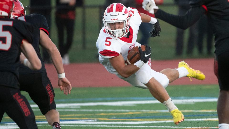 Delsea's Wayne Adair is tripped up after runing the ball during the football game between Delsea and Kingsway played at Kingsway Regional High School in Woolwich Township on Friday, September 23, 2022.  