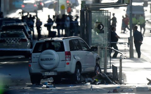 The vehicle appeared to have collided with a tram stop after hitting pedestrians   - Credit: MAL FAIRCLOUGH /AFP