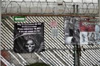 Posters of Santa Muerte (Holy Death) read: "I protect delinquents, but robbing me and in my house is your death" at a sanctuary in Santa Maria Cuautepec, Tultitlan, Mexico on February 7, 2016