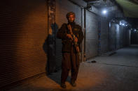 A Taliban fighter poses for a photo during a patrol in Herat Afghanistan, on Monday, Nov. 29, 2021. Since the Taliban's takeover of Afghanistan just over three months ago amid a chaotic withdrawal of U.S. and NATO troops, its fighters have changed roles, turning from fighting in the mountains and the fields to running the country. (AP Photo/ Petros Giannakouris)
