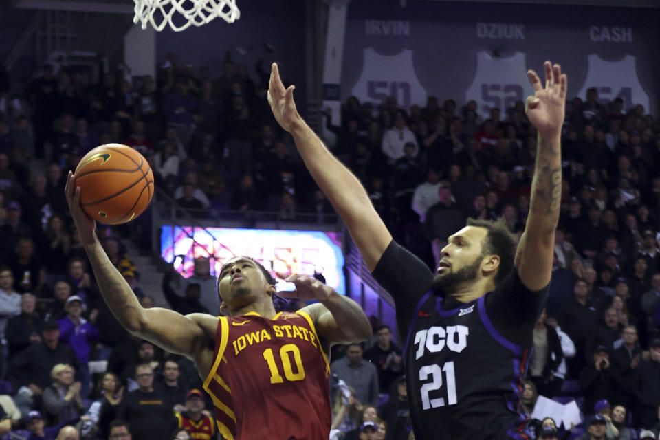 Iowa State guard Keshon Gilbert (10) shoots against TCU forward JaKobe Coles (21) in the second half of an NCAA college basketball game Saturday, Jan. 20, 2024, in Fort Worth, Texas. (AP Photo/Richard W. Rodriguez)