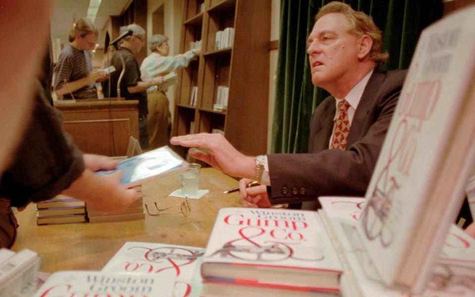 Winston Groom signs copies of Gump & Co, the sequel to Forrest Gump, at a New York bookshop in 1995 - Anders Krusberg/AP