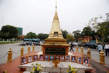 Portraits of victims of a fatal 1997 grenade attack on an opposition rally are displayed during a ceremony to remember the victims at a monument in Phnom Penh, Cambodia, March 30, 2018. REUTERS/Samrang Pring