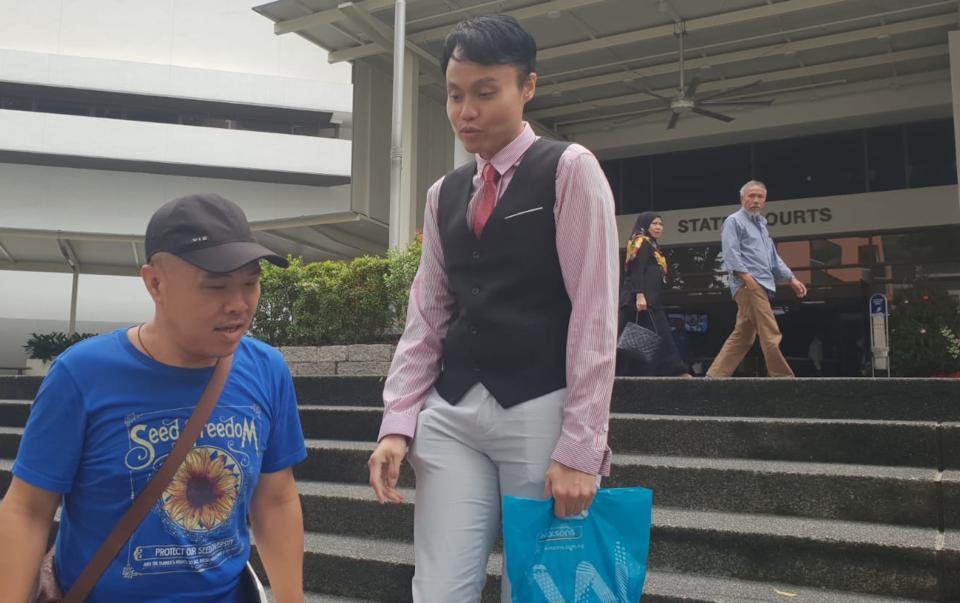 Daniel Augustin De Costa (wearing a tie) was charged with one count of criminal defamation and another count of unauthorised access to computer material last year. (Yahoo News Singapore file photo)